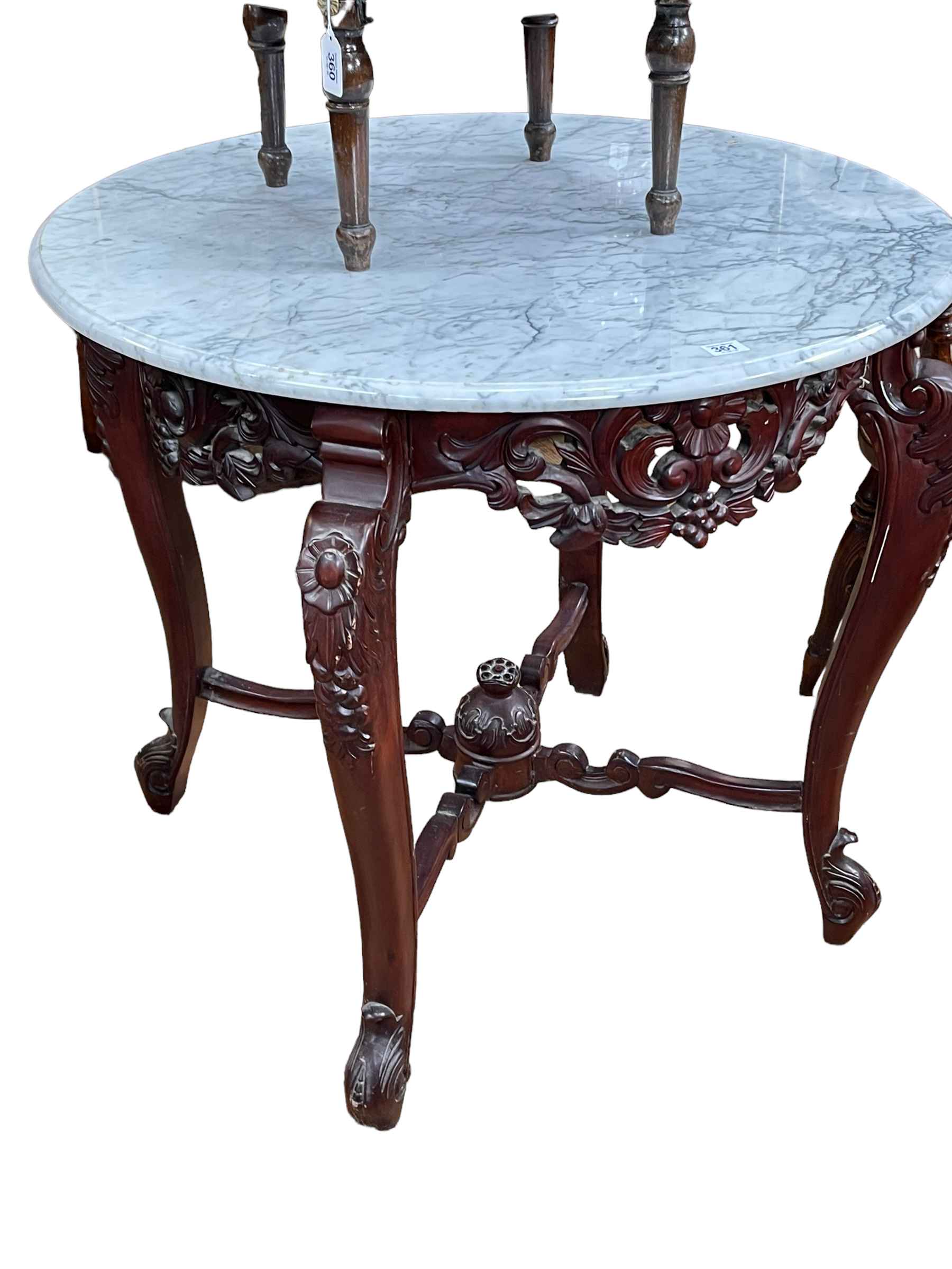 Circular marble topped centre table on carved polished wood base, 76.5cm by 86cm diameter.