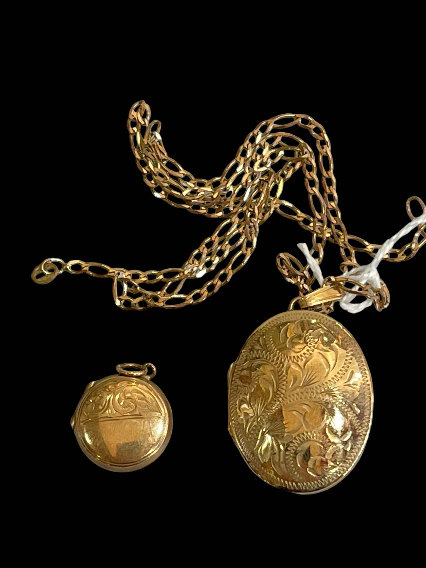 Two 9 carat gold lockets and one chain (3).