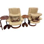 Pair ivory leather Stressless adjustable swivel chairs, footstools and side tables.