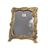 Art Nouveau style brass easel mirror.