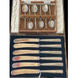 Six silver coffee spoons, Sheffield 1959, and silver handled tea knives, both boxed.