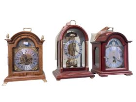 Three mantel clocks including skeleton style clock.
