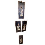 Set of four Oriental black lacquered plaques with applied figure decoration, 61cm by 25.5cm.