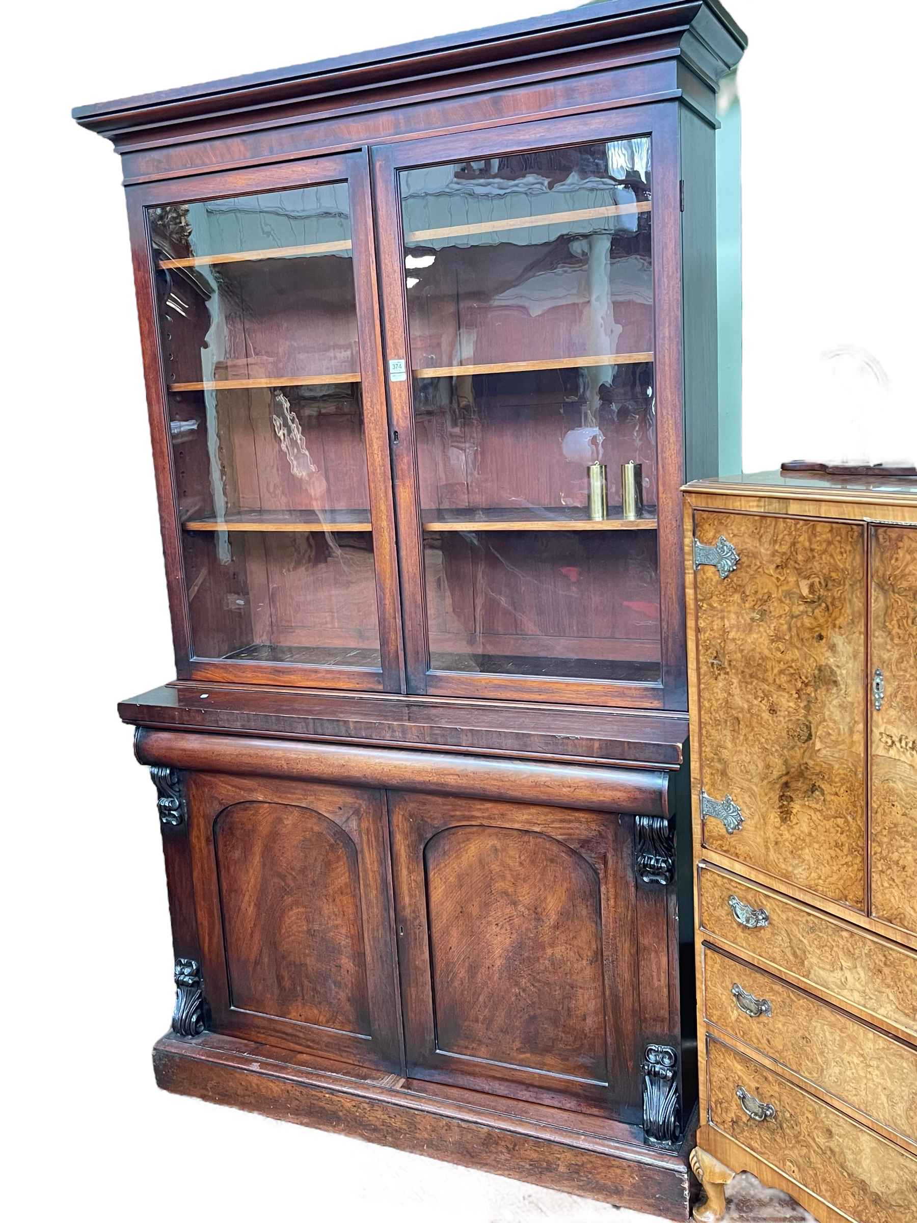 Victorian mahogany cabinet bookcase having two glazed panel doors above two arched panel cupboard