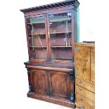 Victorian mahogany cabinet bookcase having two glazed panel doors above two arched panel cupboard