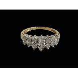 Diamond fourteen stone 9 carat gold ring, size N.