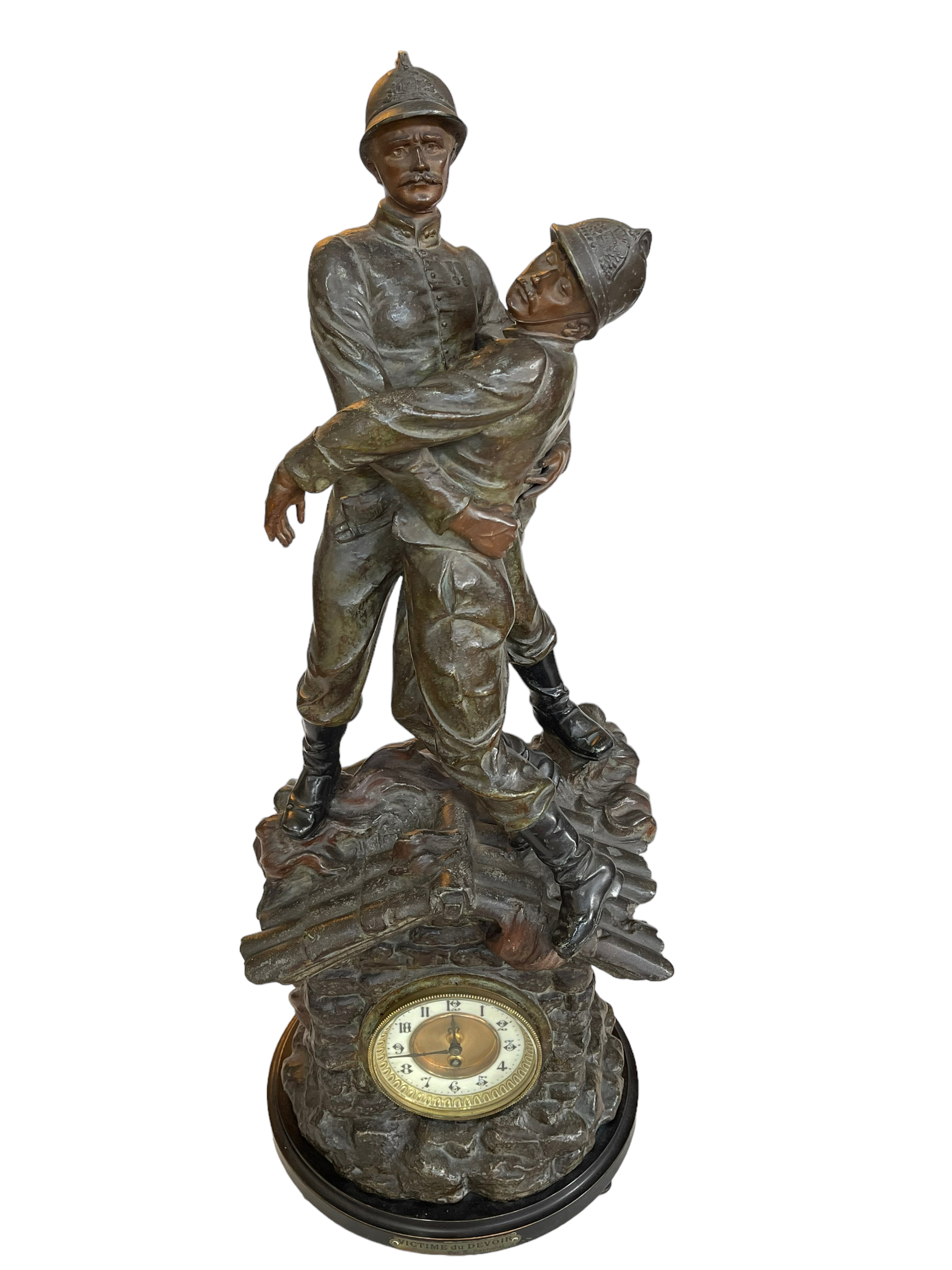 Ornate spelter clock depicting fireman, label reads 'Victime Du Devoir, Par X Raphanel', 80cm.