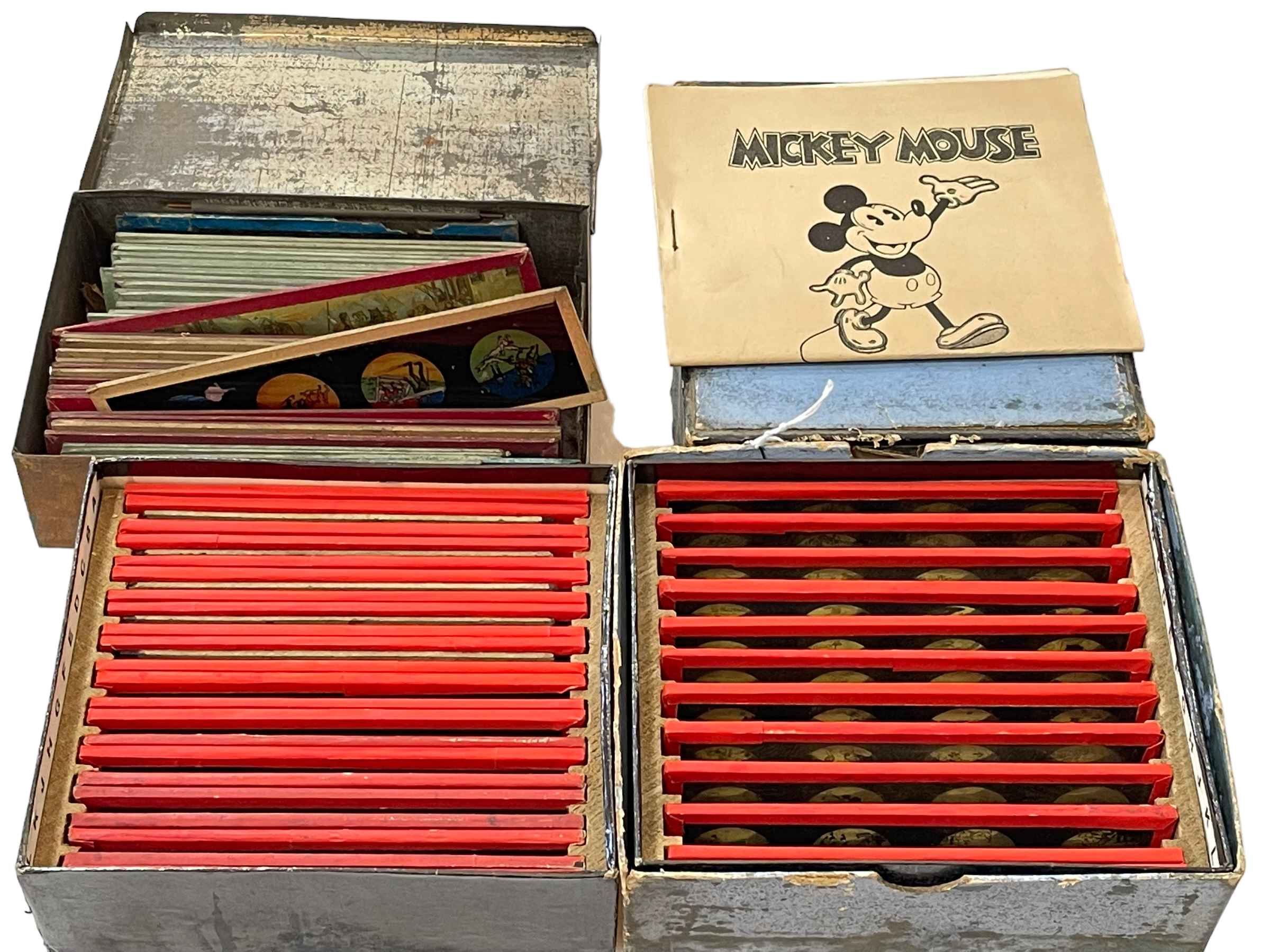 Three boxes of magic lantern slides including Mickey Mouse.