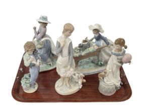 Five Lladro figures, Barrow of Fun, Goose Trying to Eat, Girl with Balloon and Cat,