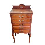 Edwardian mahogany six drawer music cabinet on cabriole legs, 106cm by 52cm by 36cm.