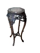 Chinese octagonal carved hardwood and marble inset top jardiniere stand, 91cm.