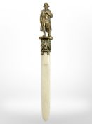 A 19th century bone and gilt metal paper knife/Stanhope with Napoleon Bonaparte finial, length 11.