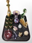 A gilt green glass bottle with stopper and six matching cups, carved onyx figure of a camel,