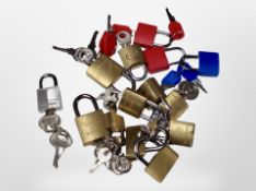 A quantity of miniature padlocks and keys