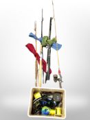 A bundle of fishing rods and reels,