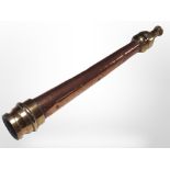 A copper and brass fire hose nozzle,