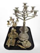 A pair of brass triple sconce candlesticks, three chamber sticks,