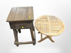 A 19th century pine stool and a modern teak folding table
