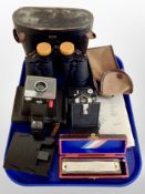 A pair of Tecnar 16 x 50 binoculars together with a Penguin camera, Polaroid land camera,