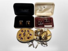 A small collection of cufflinks and dress studs