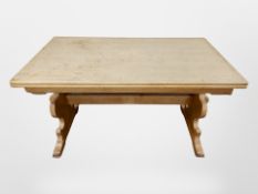 A Danish blond oak pull out extending dining table, length 140 cm un-extended.