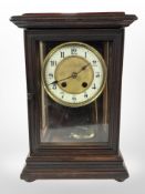 An eight day mantel clock with enamel dial,