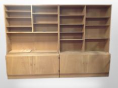 A two-section Danish oak bookcase system,