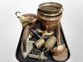 A group of copper and brass wares, pots, iron, ladle,