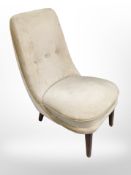A mid 20th century Danish salon chair on teak legs