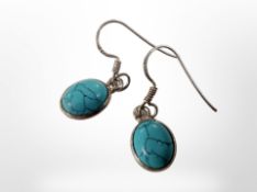 A pair of silver turquoise earrings