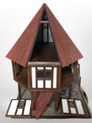 An octagonal Tudor style roundhouse, height 82 cm,
