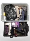 Two crates of lady's hand bags and purses