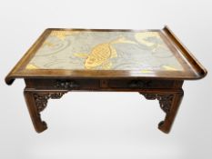 A 19th century Chinese carved hardwood low altar table fitted with two drawers,