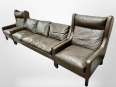 A late 20th century Danish brown leather three piece lounge suite comprising of three seater settee