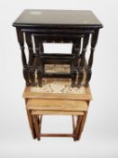 A teak tiled nest of three tables and a further set of ebonised tables