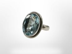 A Sterling silver dress ring set with aquamarine style stone, size L.