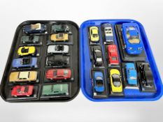 A collection of die cast Classic cars on plinths,