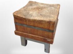 A Victorian pine and metal bound butcher's block on stand,