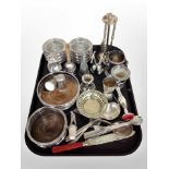 A group of silver plated bottle coasters, cutlery, sifter,