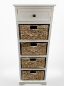 A contemporary slim chest with wicker drawers,