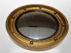 A Regency style gilt convex porthole mirror, diameter 42 cm,