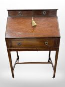 A reproduction mahogany and satinwood inlaid writing bureau,