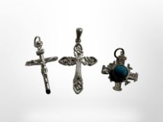 Three silver crosses