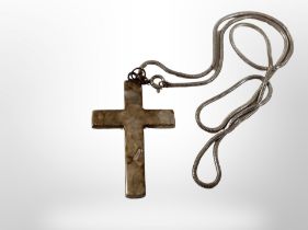 A silver chain with crucifix