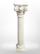 A plaster classical style pedestal,