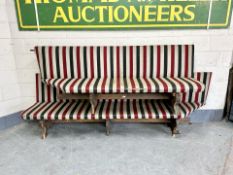 Two early 20th century benches in striped upholstery
