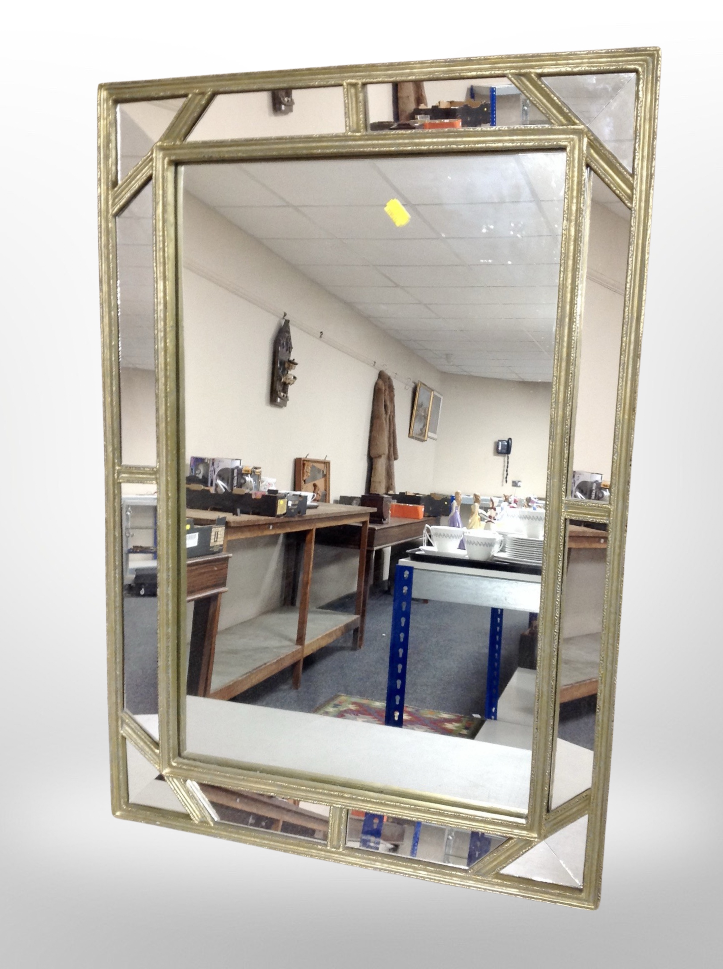 A gilt sectional mirror,