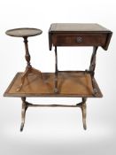 A reproduction mahogany coffee table with tooled leather inset top,