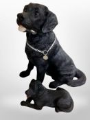 Two heavy cast resin figures of Labradors,
