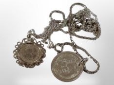Two silver coins and chains